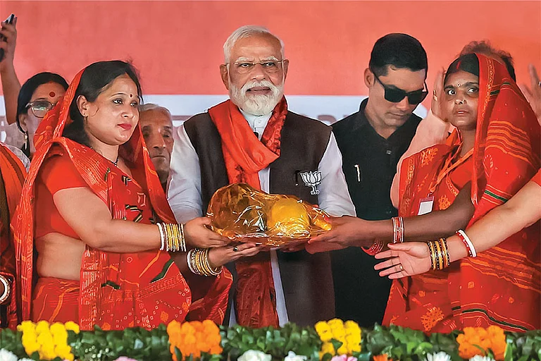 Political Capital: Prime Minister Narendra Modi being felicitated at a public meeting in Begusarai district - | Photo: PTI