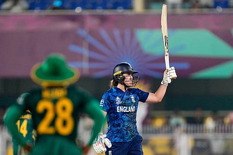 England's captain Nat Sciver-Brunt celebrates her fifty runs during the ICC Women's Cricket World Cup first semifinal match between England and South Africa at Barsapara Cricket Stadium in Guwahati.