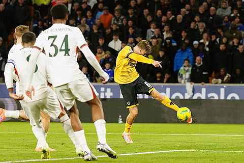 Wolverhampton Wanderers vs Chelsea: Wolverhampton Wanderers' David Moller Wolfe, right,  scores their side's second goal of the game during an English League Cup fourth round soccer match in Wolverhampton, England. 