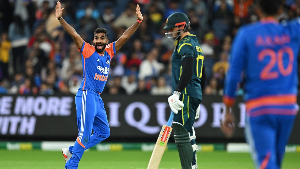 James Ross/AAP Image via AP : India's Jasprit Bumrah, left, appeals for the wicket of Australia's Mitchell Owen during their T20 cricket match in Melbourne, Australia, Friday, Oct. 31, 2025