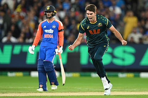 Australia's Xavier Bartlett, right, celebrates after dismissing India's Harshit Rana during their T20 cricket match in Melbourne, Australia.