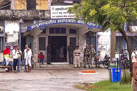 Security personnel keep vigil outside a hospital where the post-mortem of Jan Suraaj leader late Dularchand Yadav is scheduled to take place, a day after his alleged murder, at Barh in Patna district.