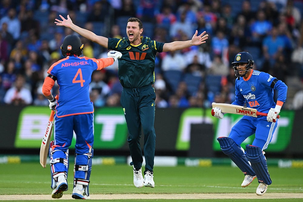 | Photo: James Ross/AAP Image via AP : Australia's Josh Hazlewood, center, appeals unsuccessfully for the wicket of India's Shubman Gill, right, during their T20 cricket match in Melbourne, Australia.