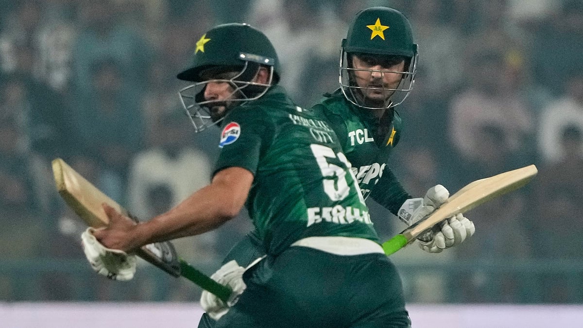 AP : Sahibzada Farhan, front, and Saim Ayub run between the wickets during the second T20 cricket match.