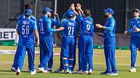 X/Afghanistan Cricket Board : Afghanistan celebrate a West Indies wicket in a T20I match in Harare.