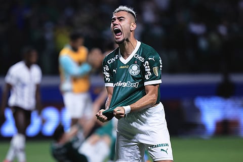 Andreas Pereira of Brazil's Palmeiras celebrates at the end of the Copa Libertadores semifinal second leg soccer match against Ecuador's Liga Deportiva Universitaria in Sao Paulo.
