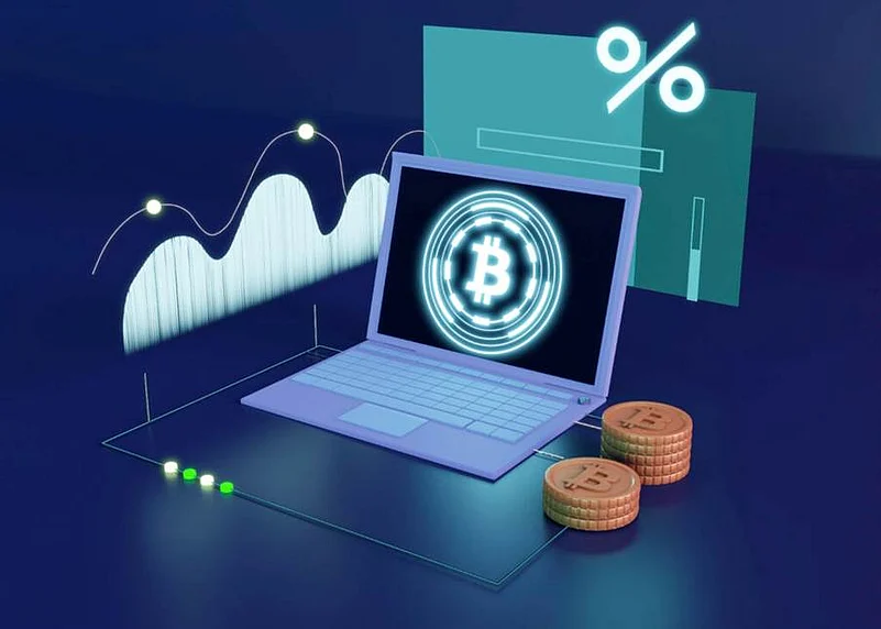 Stylized illustration of a laptop with glowing Bitcoin symbol, coins, and graphs