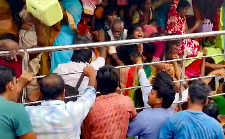 People gather at Venkateswara temple, at Kasibugga in Srikakulam district, Andhra Pradesh, Saturday, Nov. 1, 2025. - Screengrab from PTI videos