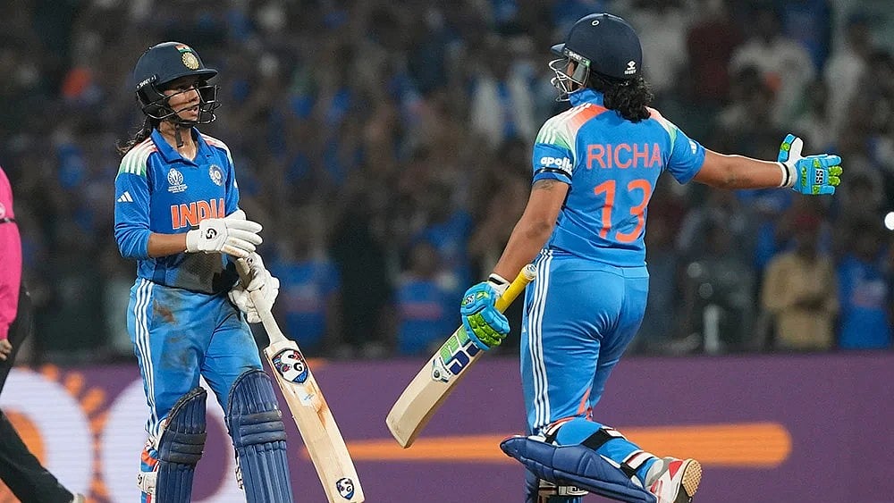 | Photo: AP/Rajanish Kakade : India's Jemimah Rodrigues, left, celebrates her century with India's Richa Ghosh during the ICC Women's Cricket World Cup cricket semi final match between India and Australia at DY Patil Stadium in Navi Mumbai.
