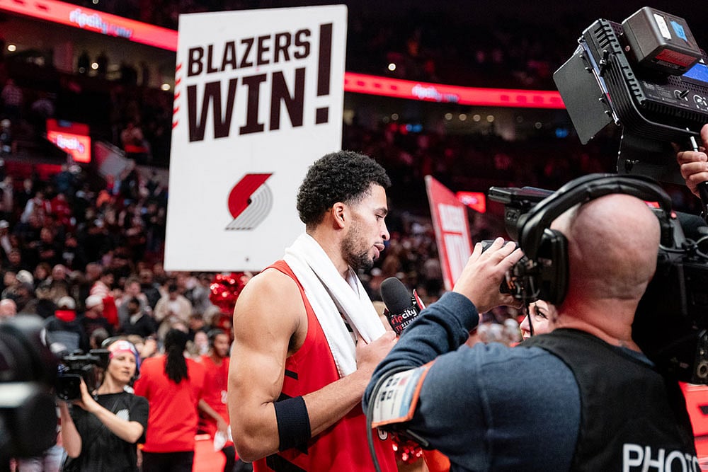 | Photo: AP/Ali Gradischer : Portland Trail Blazers forward Toumani Camara, center, gives a post game interview after the Blazers NBA Cup basketball win over the Denver Nuggets game in Portland, Ore.