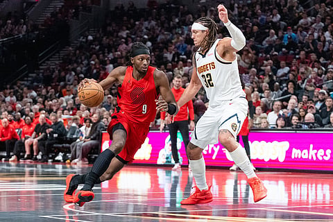 Denver Nuggets forward Aaron Gordon (32) defends against Portland Trail Blazers forward Jerami Grant (9) during the second half of an NBA Cup basketball game in Portland, Ore.