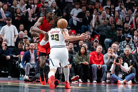 Denver Nuggets forward Aaron Gordon (32) loses the ball against Portland Trail Blazers forward Jerami Grant, left, during the second half of an NBA Cup basketball game in Portland, Ore.