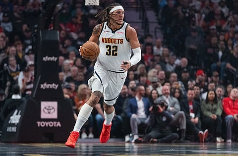 Denver Nuggets forward Aaron Gordon dribbles upcourt during the first half of an NBA Cup basketball game against the Portland Trail Blazers, in Portland, Ore.