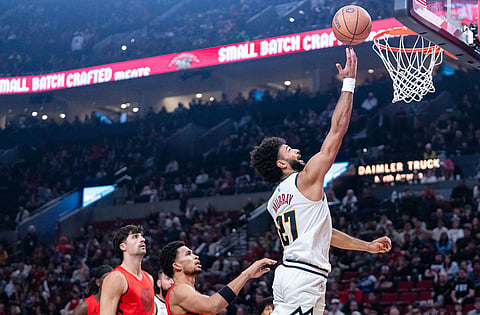 Denver Nuggets guard Jamal Murray (27) goes for a layup during the first half of an NBA Cup basketball game against the Portland Trail Blazers in Portland, Ore.