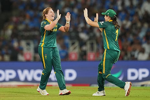 South Africa's Nadine de Klerk, left, celebrates the dismissal of India's Amanjot Kaur during the ICC Women's Cricket World Cup final match between India and South Africa in Navi Mumbai.