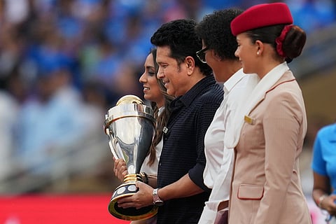Former Indian cricketer Sachin Tendulkar with the trophy arrives the ground before start the ICC Women's Cricket World Cup final match between India and South Africa in Navi Mumbai.