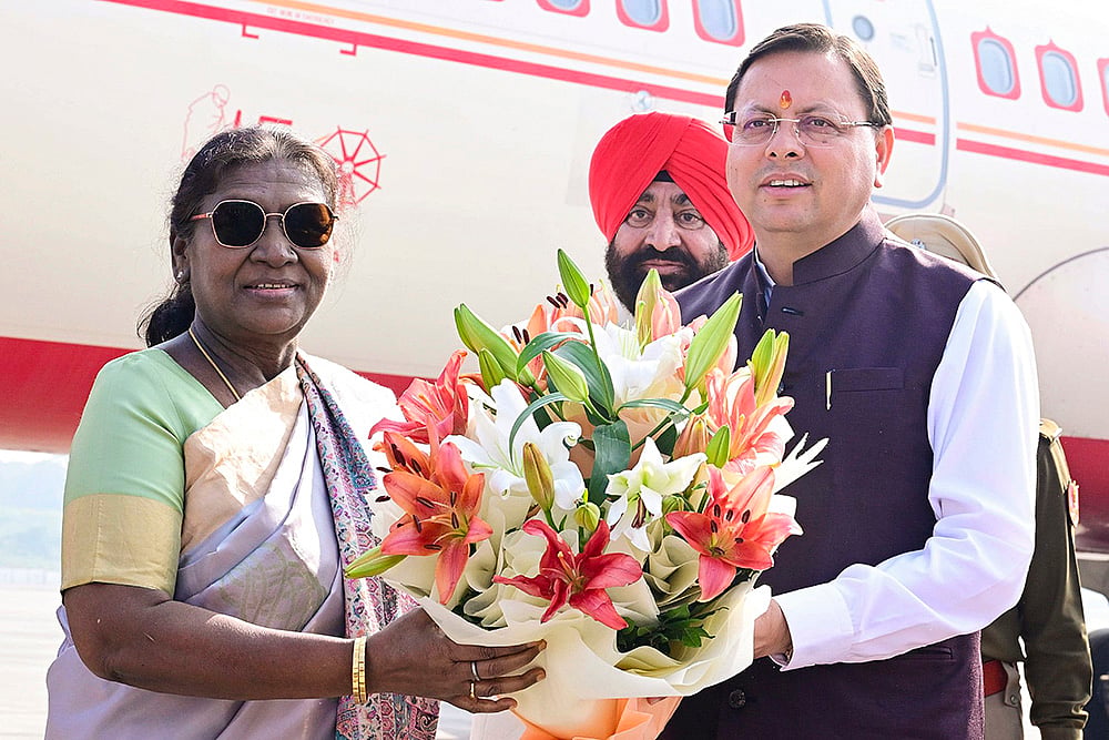 | Photo: @rashtrapatibhvn/X via PTI  : President Droupadi Murmu being received by Uttarakhand Chief Minister Pushkar Singh Dhami on her arrival in Dehradun. State Governor Lt. Gen. Gurmit Singh (Retd.) also present. 