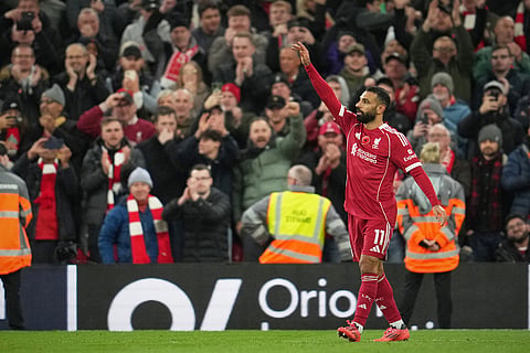 Liverpool's Mohamed Salah reacts during the English Premier League soccer match between Liverpool and Aston Villa in Liverpool, England.