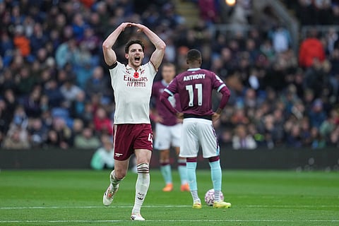 Arsenal's Declan Rice celebrates after scoring his side's second goal during the English Premier League soccer match between Burnley and Arsenal in Burnley, England.
