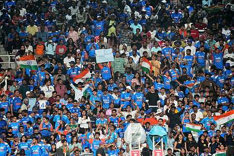 India's fans cheer for their team during the ICC Women's Cricket World Cup final match between India and South Africa in Navi Mumbai.