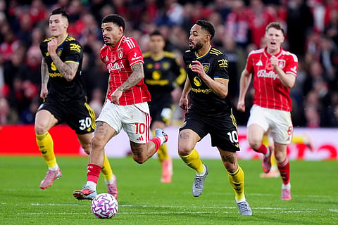 Manchester United's Matheus Cunha, right, and Nottingham Forest's Morgan Gibbs-White in action during the English Premier League match between Nottingham Forest and Manchester United in Nottingham, England.