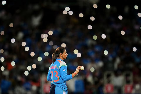 India's captain Harmanpreet Kaur fields a ball during the ICC Women's Cricket World Cup final match between India and South Africa in Navi Mumbai.