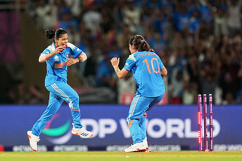 India's players celebrate the runout of South Africa's Tazmin Brits during the ICC Women's Cricket World Cup final match between India and South Africa in Navi Mumbai.