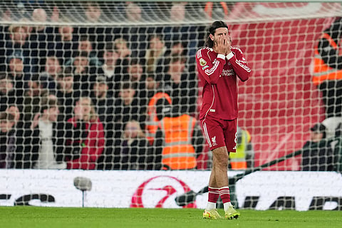 Liverpool's Dominik Szoboszlai reacts during the English Premier League soccer match between Liverpool and Aston Villa in Liverpool, England.