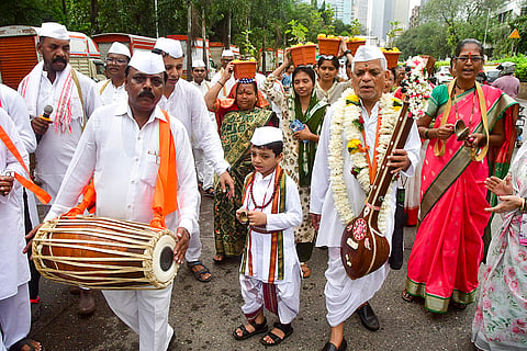 People take part in "dindi procession" on the Kartik Shukla Ekadashi, when Lord Vishnu awakens after a four-month period, in Mumbai.