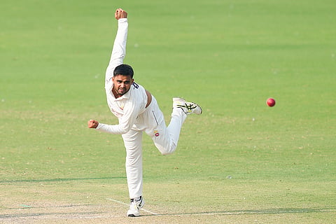 Delhi's Sumit Mathur bowls during the second day of the Ranji Trophy cricket match between Delhi and Puducherry, at Arun Jaitley Stadium in New Delhi.
