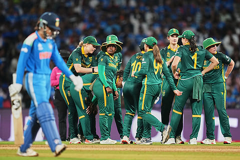 South Africa's players celebrates the dismissal of India's Smriti Mandhana, left, during the ICC Women's Cricket World Cup final match between India and South Africa in Navi Mumbai.