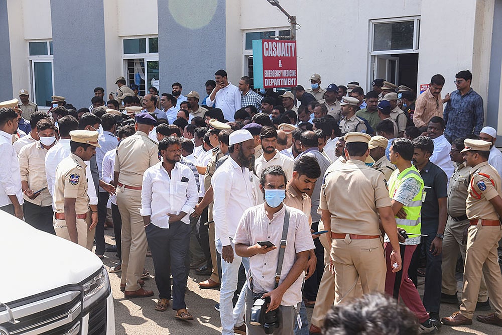 Photo: PTI : Police personnel outside a hospital where injured are receiving medical treatment after a tipper lorry carrying gravel collided head-on with a public transport bus, in Ranga Reddy district, Telangana.