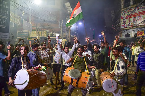 People celebrate after the Indian cricket team won the ICC Women's World Cup 2025, in Prayagraj, Uttar Pradesh.