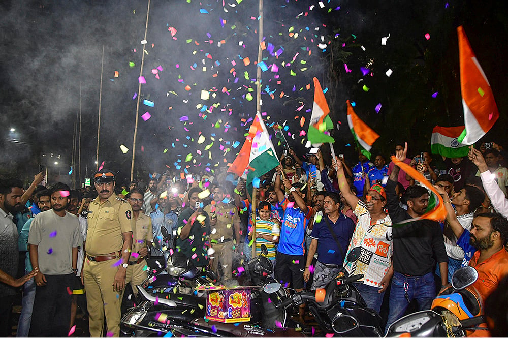 | Photo: PTI : People celebrate after the Indian cricket team won the ICC Women's World Cup 2025, at Dadar, in Mumbai, Maharashtra.