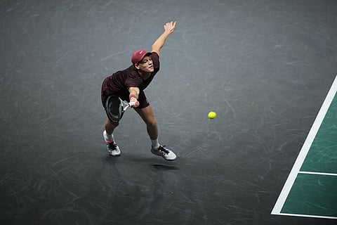 Italy's Jannik Sinner returns to Canada's Felix Auger-Aliassime during the final match of the Paris Masters tennis tournament in Paris.