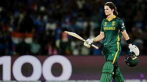Photo: AP : Captain Laura Wolvaardt celebrates her century during the ICC Women's Cricket World Cup final between India and South Africa in Navi Mumbai.