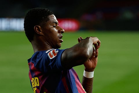 Barcelona's Marcus Rashford celebrates after scoring his side's third goal during a Spanish La Liga soccer match between FC Barcelona and Elche CF in Barcelona, Spain.