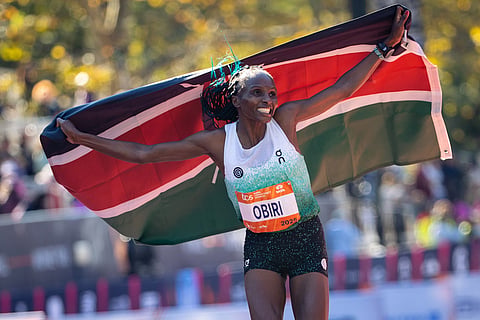 Hellen Obiri celebrates winning first place in the women's elite division of the New York City Marathon in New York. 