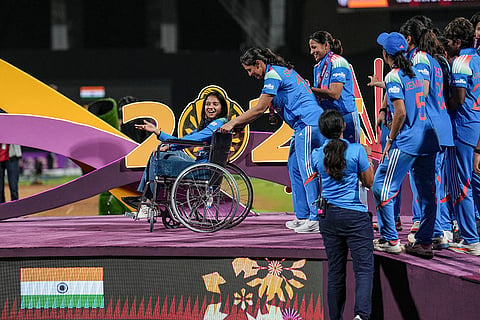 India’s Smriti Mandhana brings teammate Pratika Rawal on a wheelchair as the team arrive to receive winning medals during the presentation ceremony after winning the ICC Women's World Cup 2025, at the DY Patil Stadium, in Navi Mumbai.