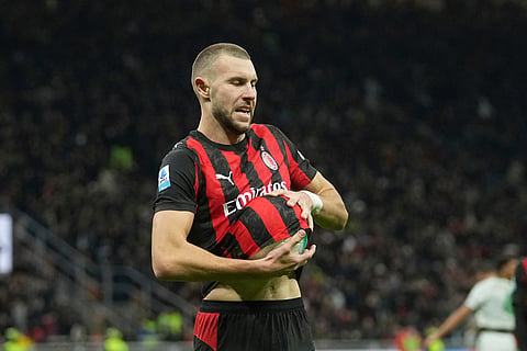 AC Milan's Strahinja Pavlovic celebrates after scoring the opening goal during the Serie A soccer match between AC Milan and Roma in Milan, Italy.