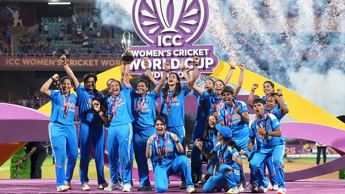 India's players pose with the winning trophy after their win over South Africa in the ICC Women's Cricket World Cup final match in Navi Mumbai, India, Monday, Nov. 3, 2025 - AP Photo/Rafiq Maqbool