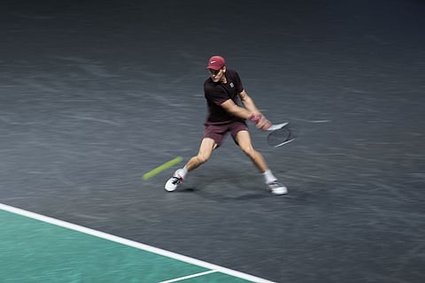 Italy's Jannik Sinner returns to Canada's Felix Auger-Aliassime during the final match of the Paris Masters tennis tournament in Paris.