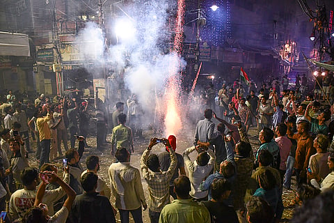 People celebrate after the Indian cricket team won the ICC Women's World Cup 2025, in Prayagraj, Uttar Pradesh.