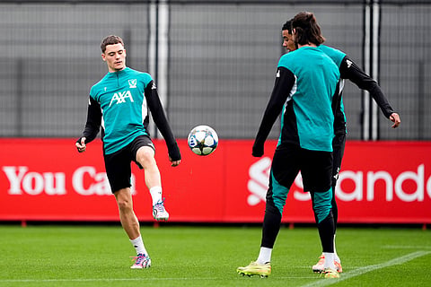 Liverpool's Florian Wirtz, left, plays the ball during a training session in Liverpool, England.