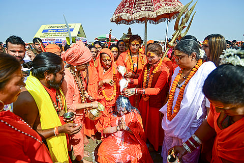 'Kinner Akhara' members during the 'pattabhishek' ritual of Mahamandaleshwar Kaushalya Nand Giri alias Tina Maa, at the Sangam, in Prayagraj.