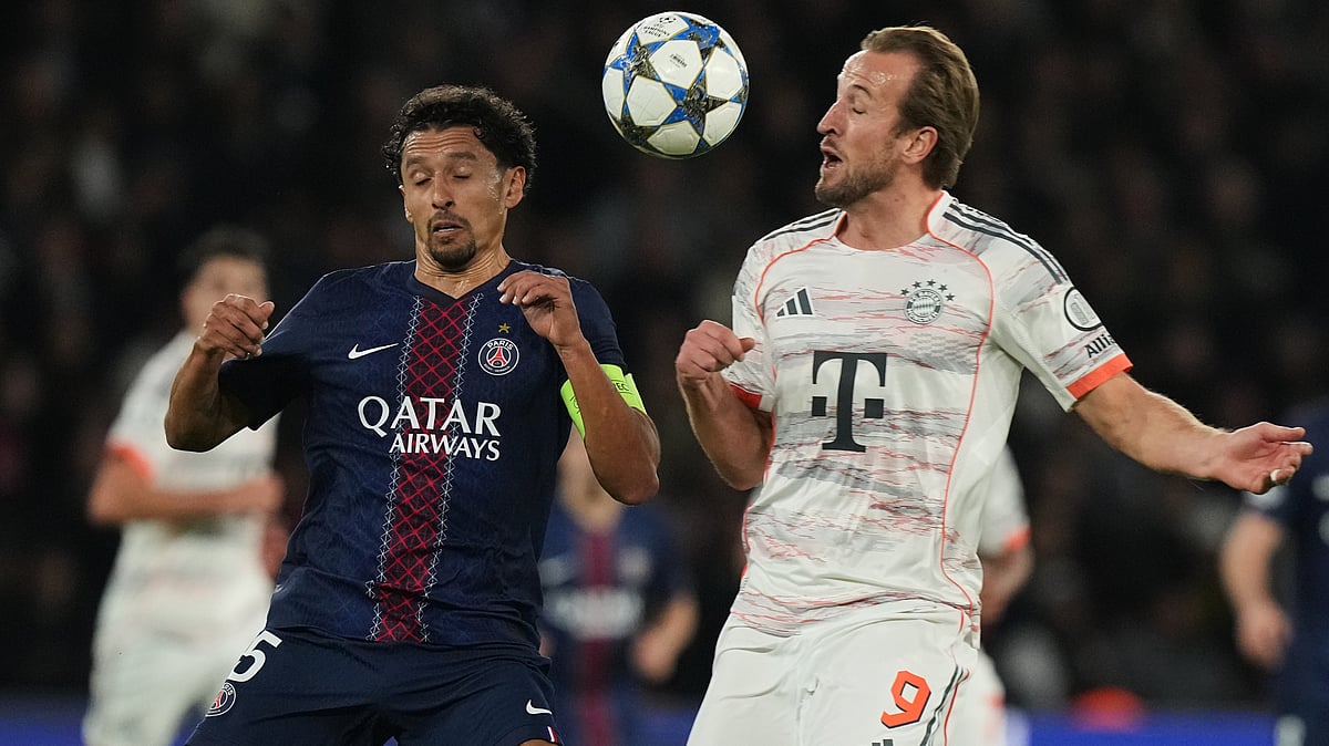 AP/Thibault Camus : Marquinhos, left, and Bayern's Harry Kane challenge for the ball during the Champions League opening phase soccer match.