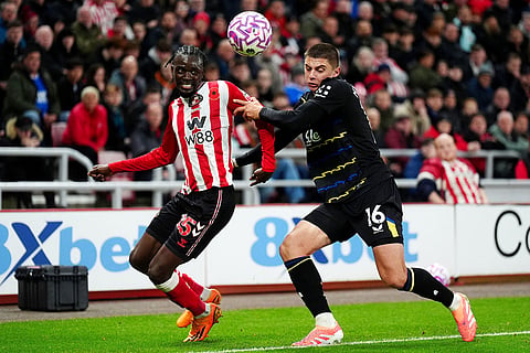 Sunderland's Bertrand Traore, left, and Everton's Vitaliy Mykolenko in action during the English Premier League soccer match between Sunderland and Everton in Sunderland, England.