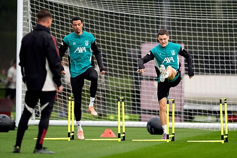 Liverpool's Hugo Ekitike, rear left, and Florian Wirtz, right, during a training session in Liverpool, England.