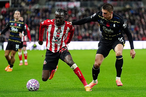 Sunderland's Bertrand Traore, left, and Everton's Vitaliy Mykolenko in action during the English Premier League soccer match between Sunderland and Everton in Sunderland, England.