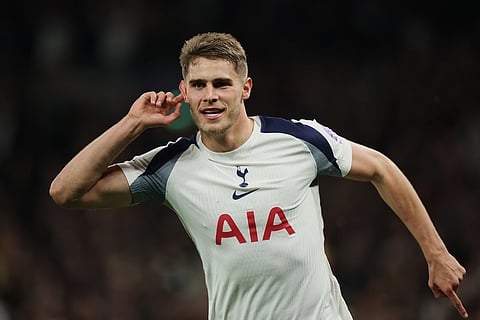 Tottenham's Micky van de Ven celebrates after scoring his side's third goal during the Champions League opening phase soccer match between Tottenham and Copenhagen, in London, England.
